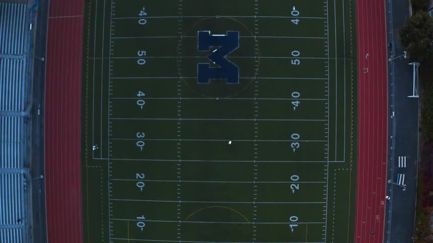 Aerial view of a stadium is displayed in spring