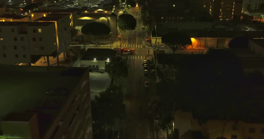 A city with buildings trees vehicle streets and pedestrians