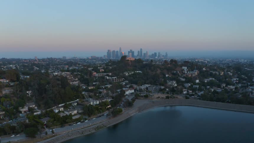 The sun is rising on the city