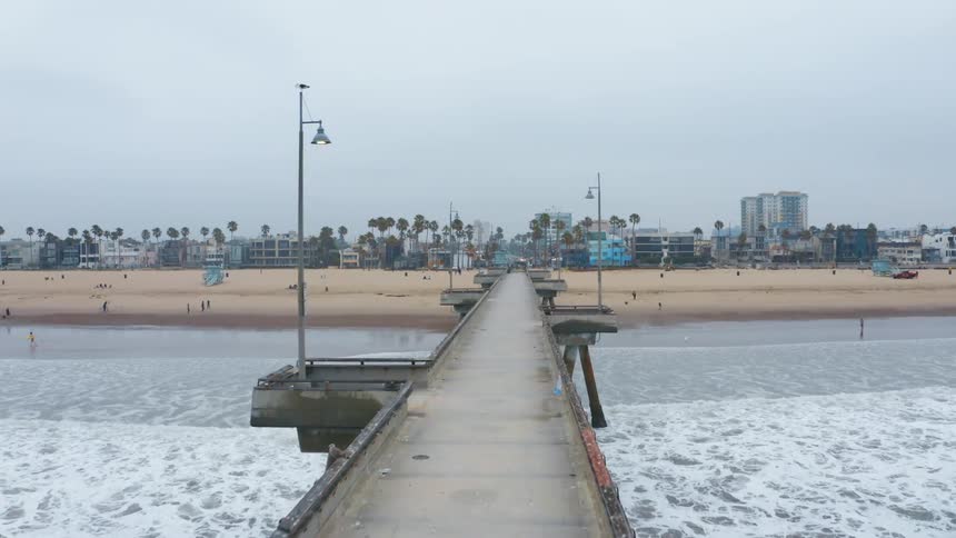 An aerial view of a boardwalk and the ocean