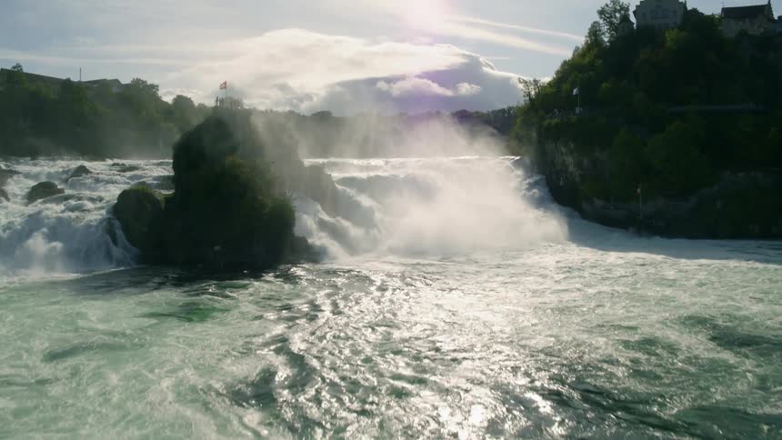 Aerial view of a waterfall is displayed in spring