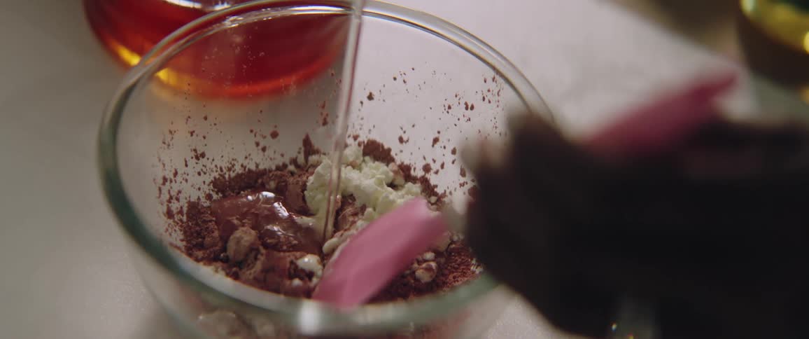 A person making food in a bowl