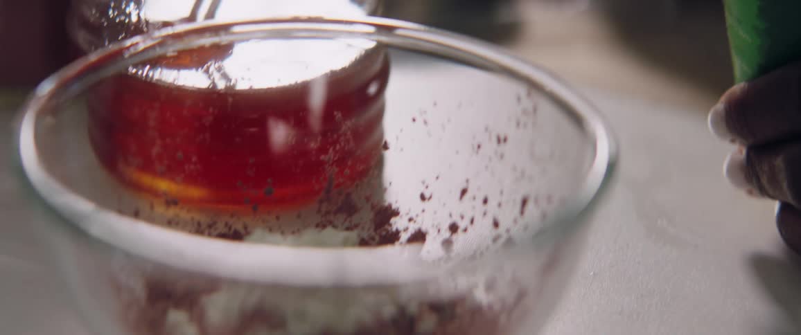 Liquid being added to a bowl of ingredients with a pipette