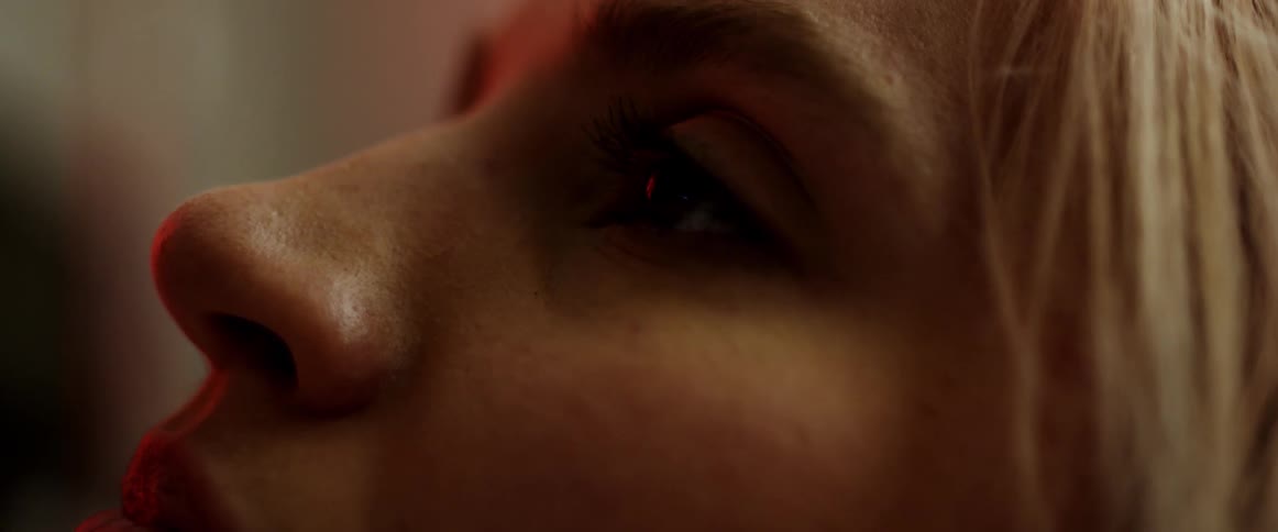 A person opening their eyes