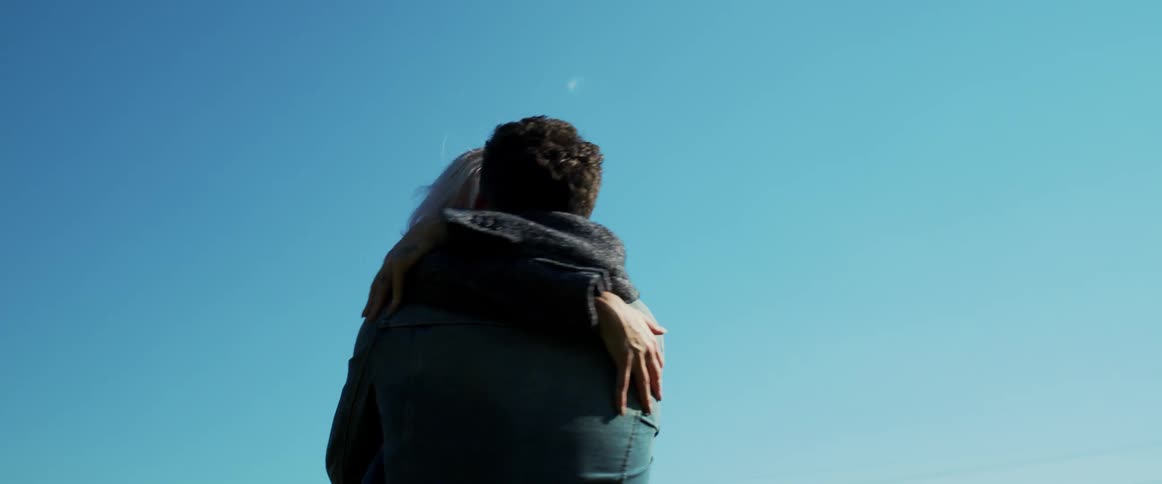 Female and male hugging