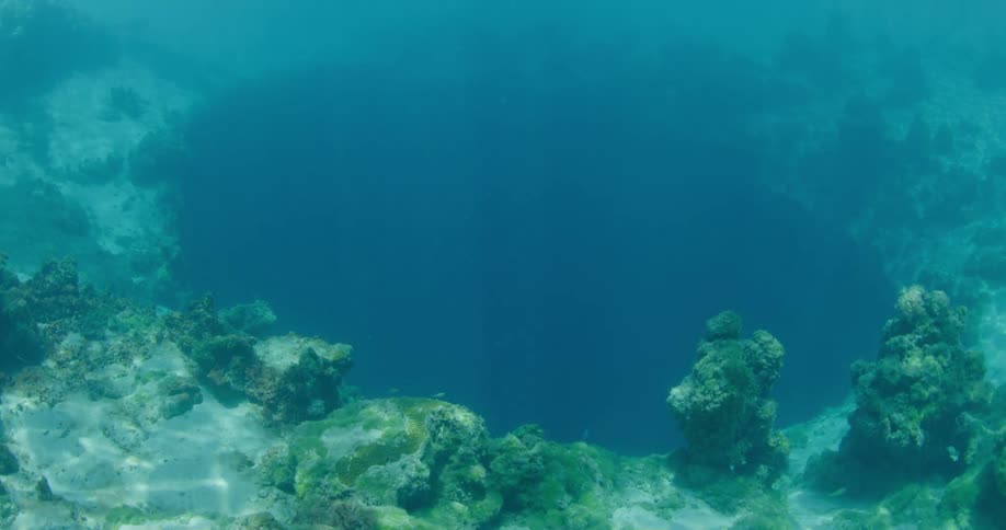 Coral reef surround a cavern in the ocean