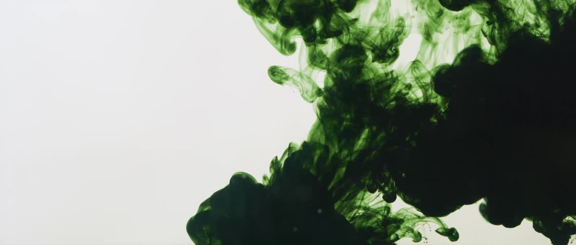 White black and green colors that look like paint and water