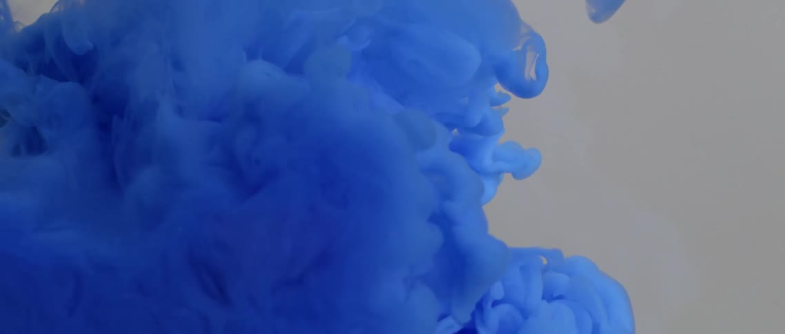 Liquid paint slowly moving and coming together and disappearing