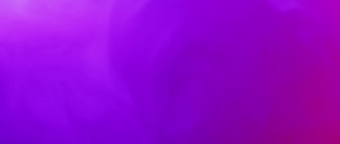 Purple and red smoke floats in the air