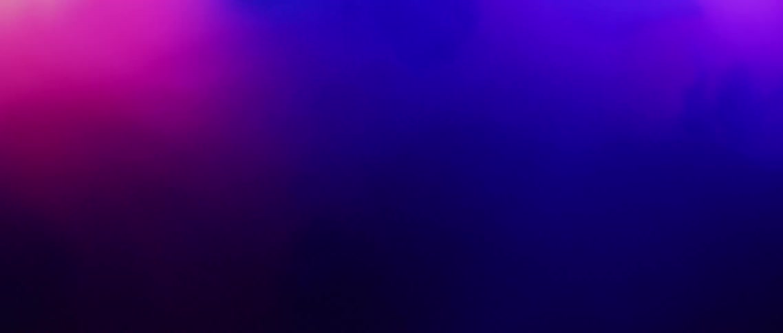 A bright light glows behind purple powder that changes shape and color as it spreads