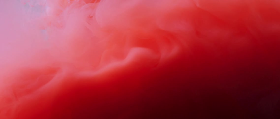 Red pink and white colors that look like paint and water
