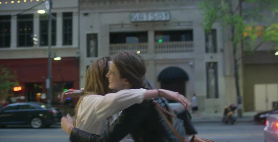 Two friends giving each other a hug