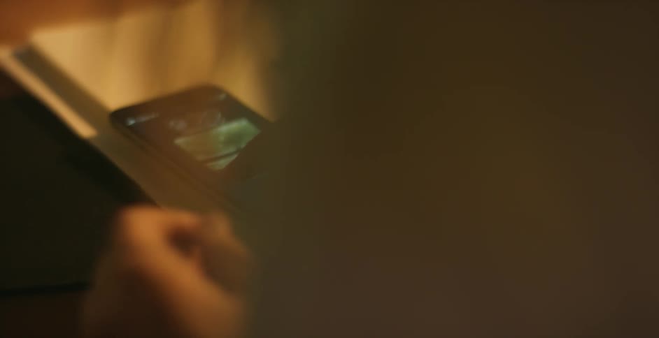 Woman uses her fingers to unlock smartphone