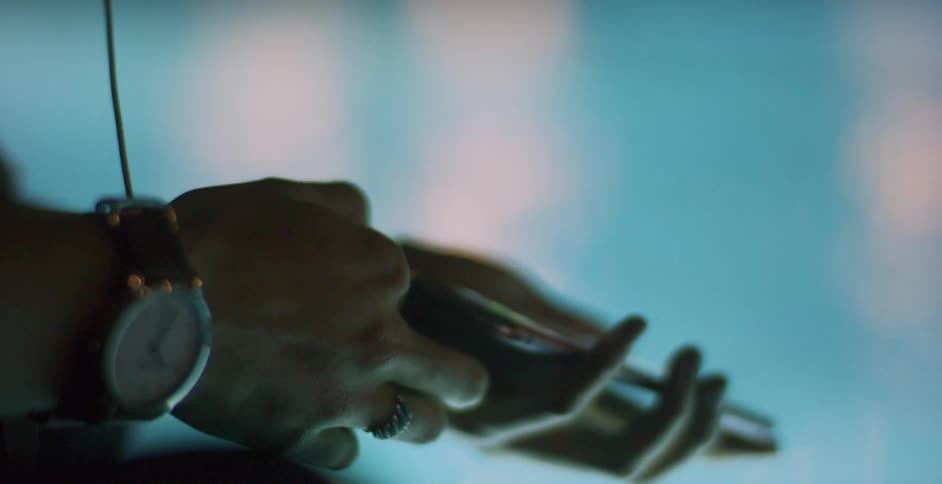 Person plugging in their cell phone