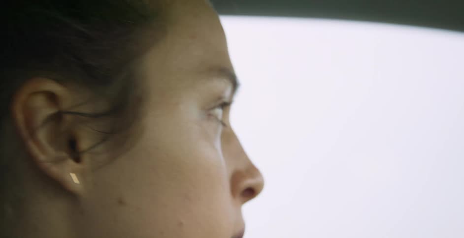 A woman drives a vehicle
