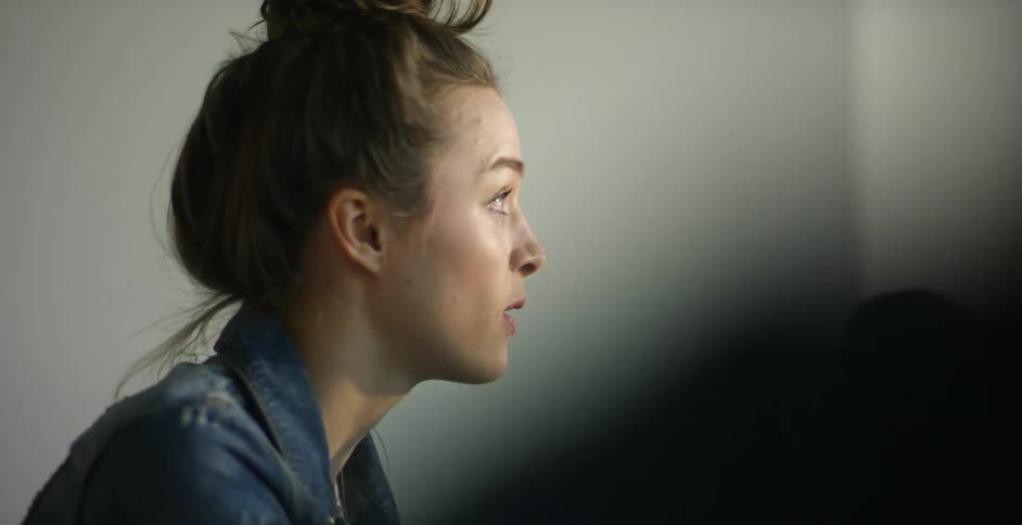 A person with their hair in a bun