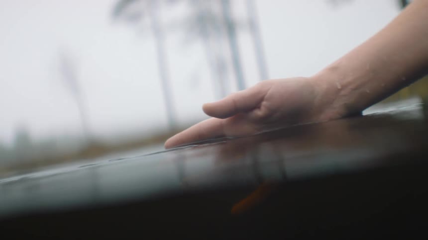 A person moves their hand in the water