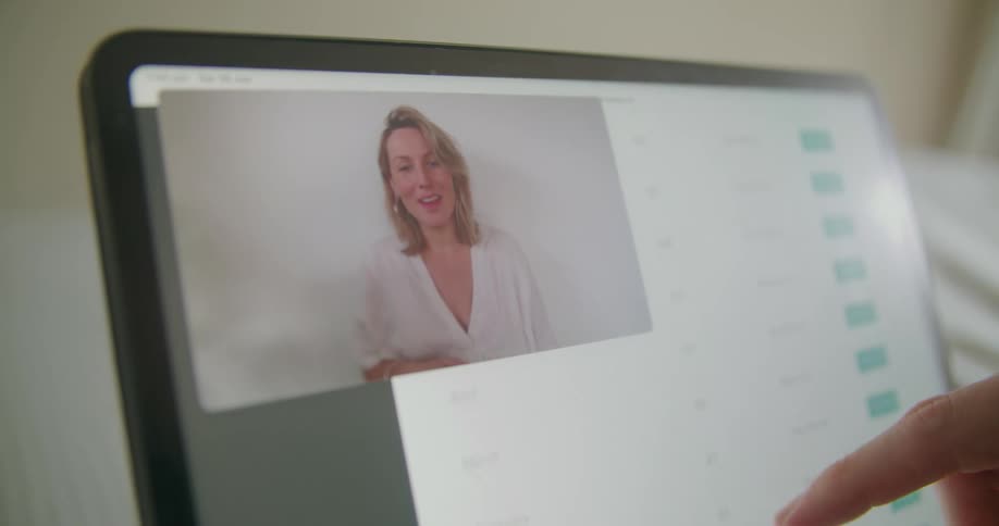 Woman talking on monitor
