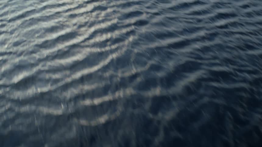 Waves ripple on the surface of the ocean during the day