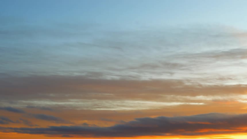A sky with clouds and sunlight