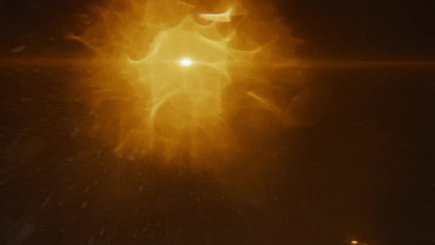 A glowing orange light in darkness