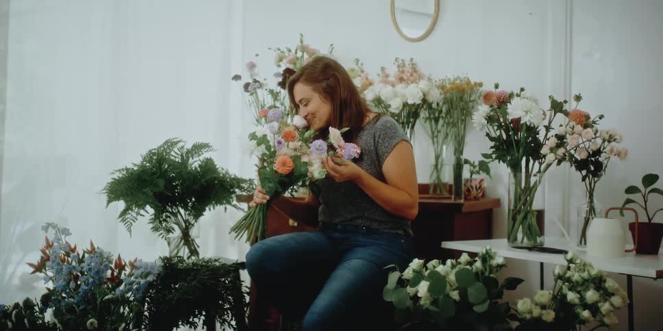 Woman smelling flowers