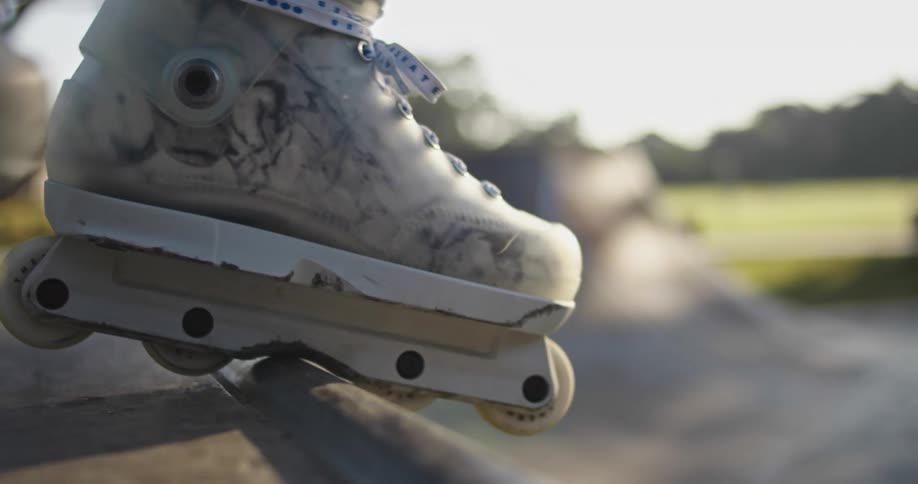A person is roller blading at a public park