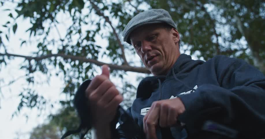 A man wrapping his hands with a piece of fabric