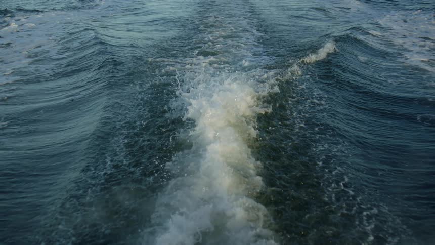 The wake behind a large boat in slow motion