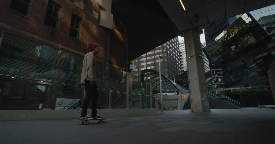 A man skateboarding in a city