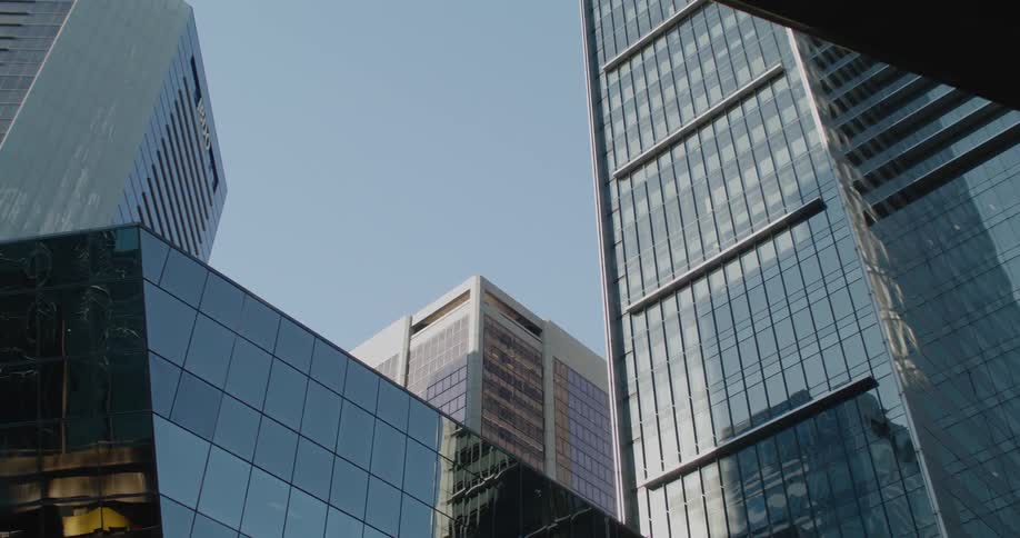 Skyscrapers with mirror like exteriors in a metropolis on a sunny day