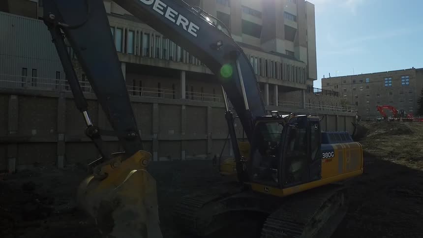 Heavy equipment digging at a construction site