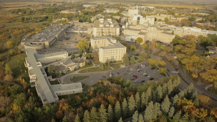 Aerial view of a large compound at the edge of the city