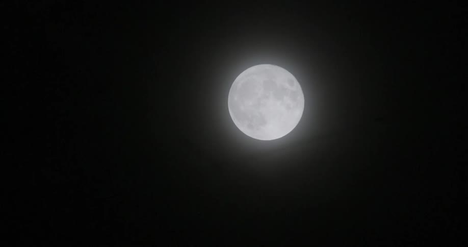 A view of the moon shining at night