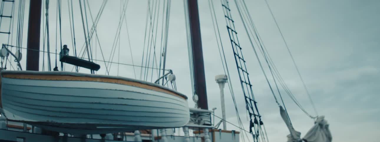A boat sailing on the ocean outdoors