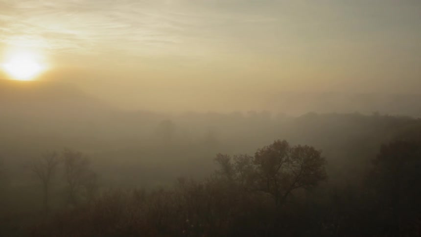 Golden sunrise over the mountain in the distance