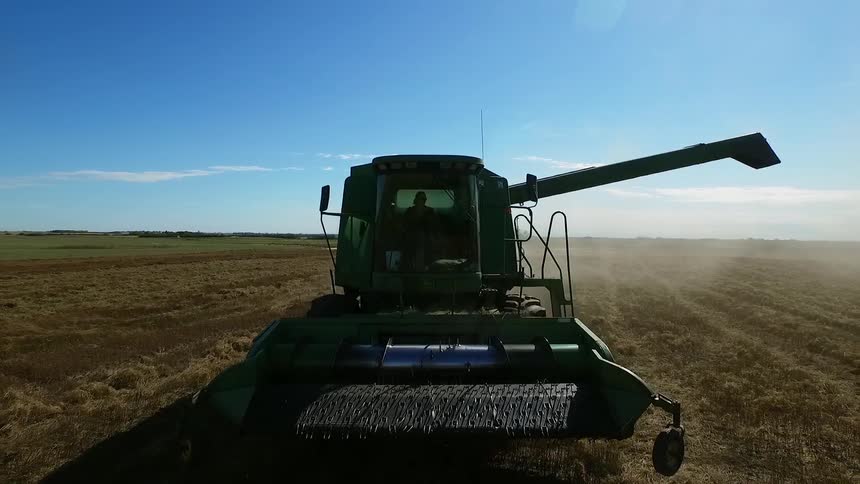 A large farm vehicle is working a field