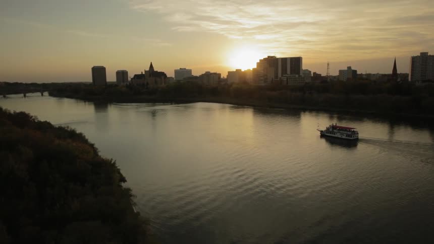 A large boat in a river at dawn