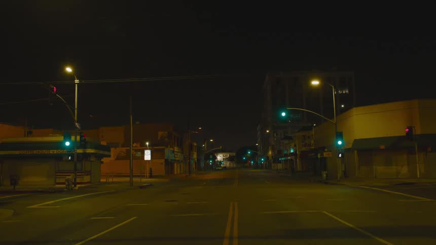 A view down a street in a city at night