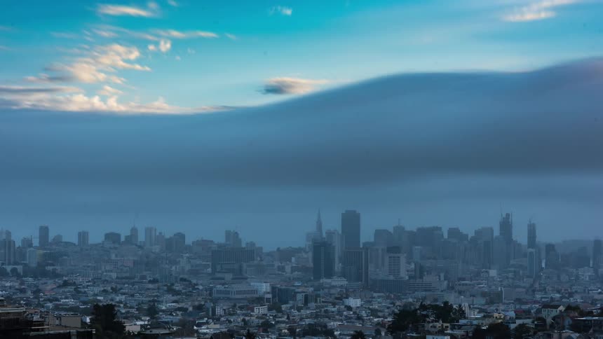 A timelapse of a city skyline in the daytime