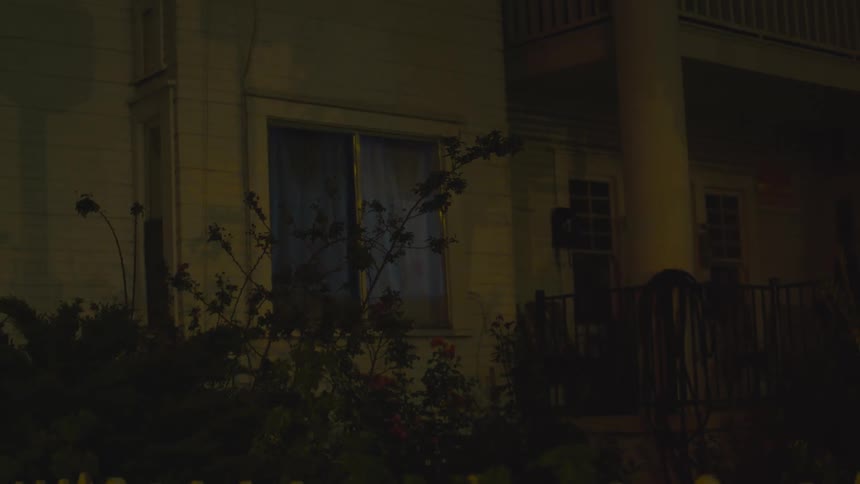 Shadows from the street are reflecting onto a house