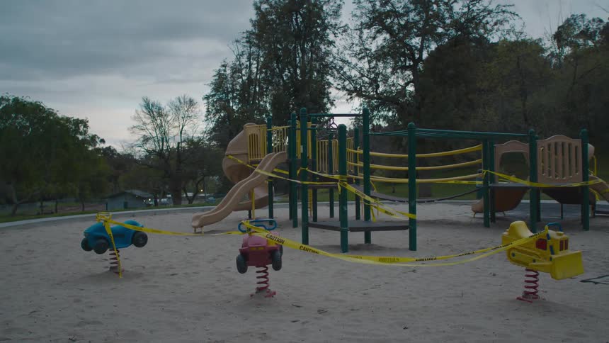 Caution tape closing off a public playground