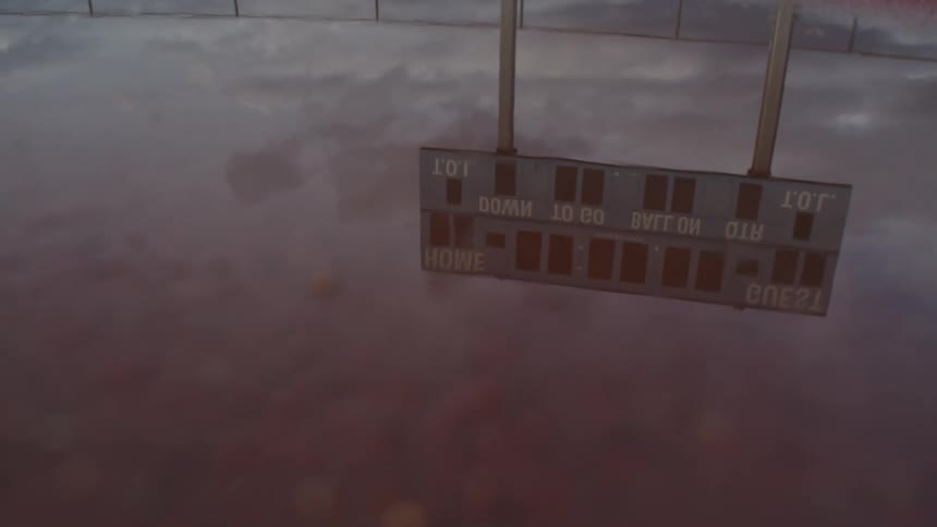 The reflection of a sign in water