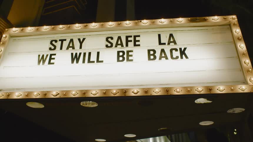An encouraging message is displayed on a theater marquee