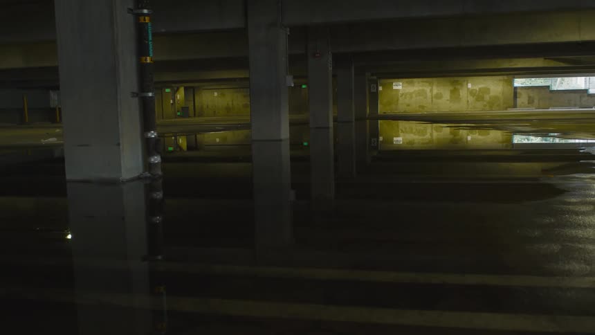 Water puddles are shown below a tunnel