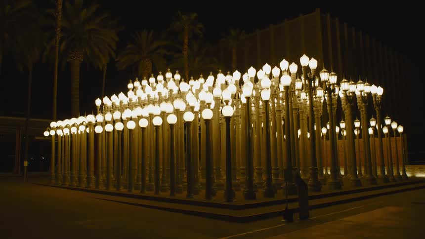 Rows of glowing streetlamps at night