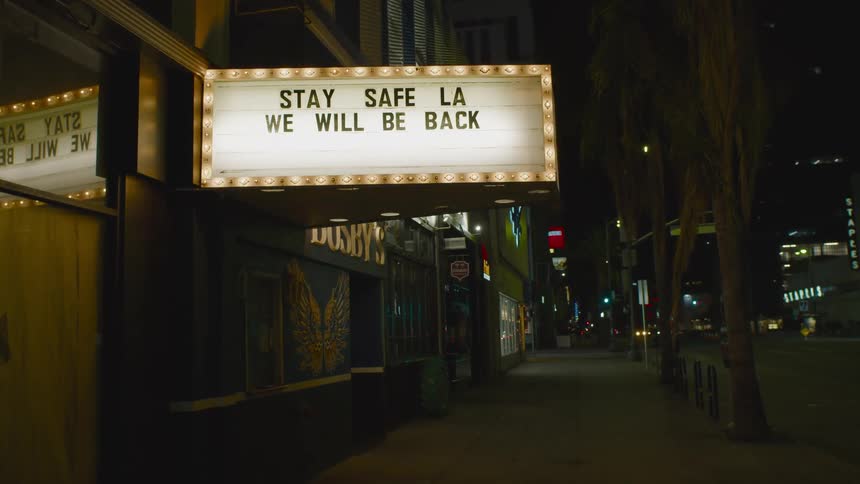 The sign is flashing over the movie theater