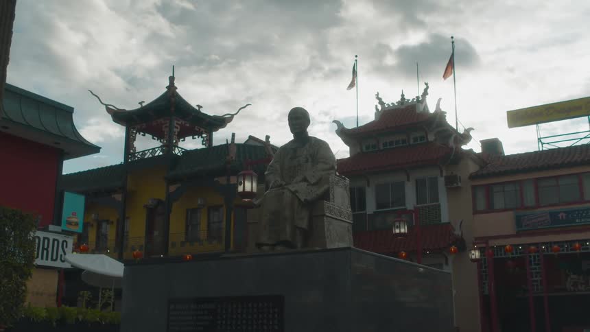 A view of a statue sitting in a city