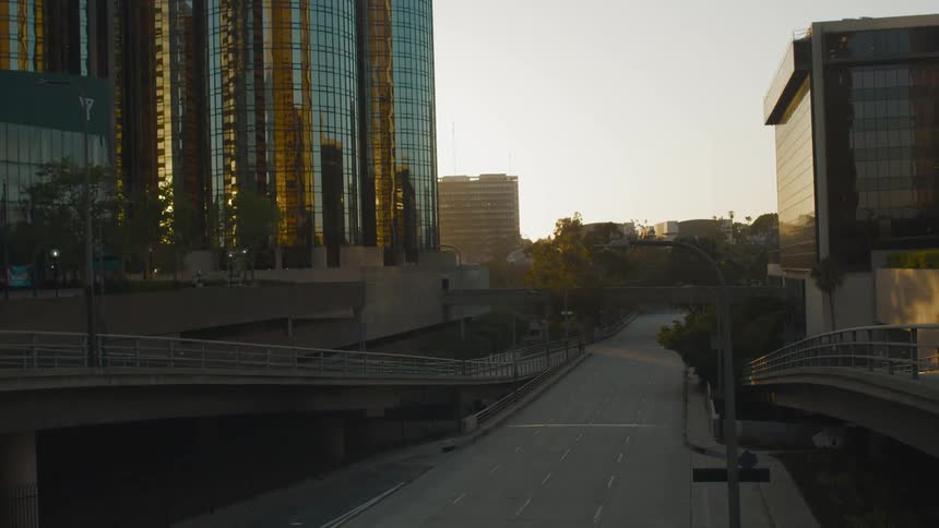 A wide city street with tall buildings visible at a distance