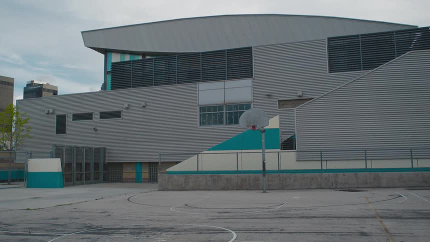 The basketball court is empty during the day
